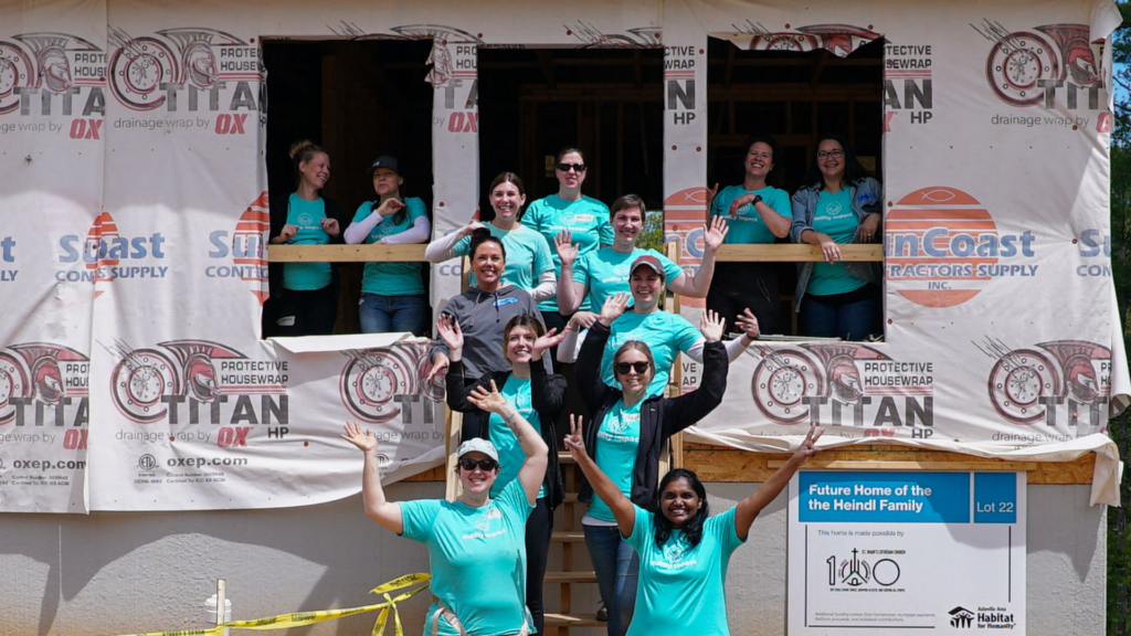 Quility staff at a volunteer home build event