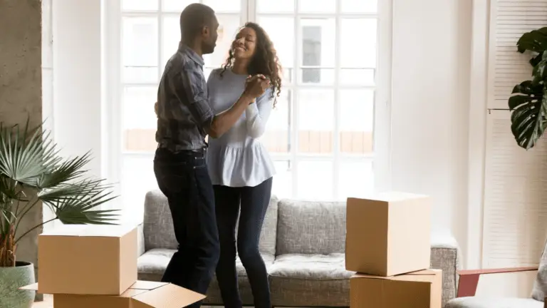 man and woman dancing in living room