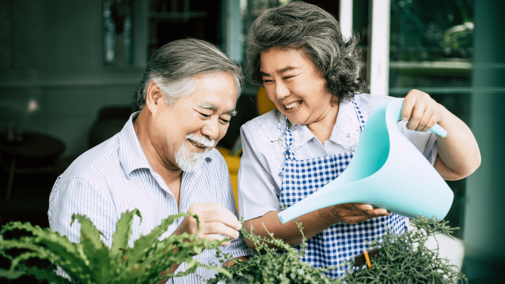 husband and wife watering flowers, using annuities for retirement savings