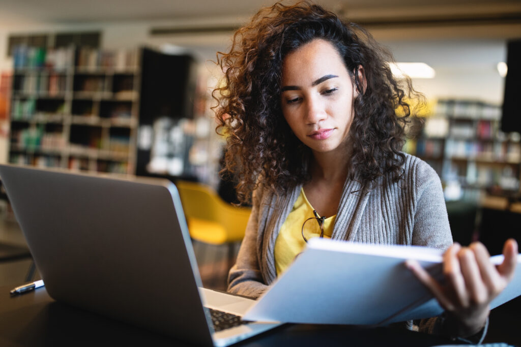 woman on computer i have debt is life insurance right for me