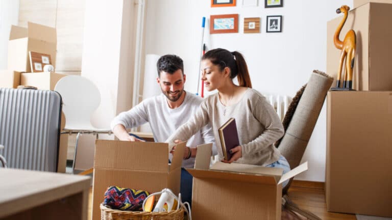 husband and wife in living room, protected with mortgage protection insurance